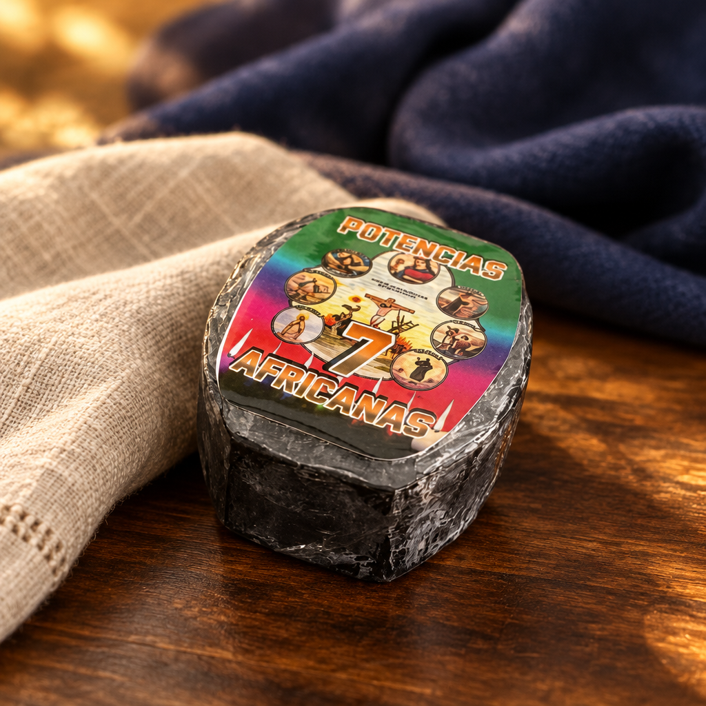 7 African Powers ritual bar soap beside a soft linen towel on a dark wooden surface in warm light